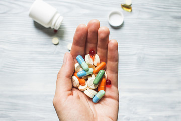Colorful pills and medicines in the hand