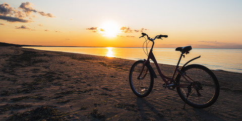 Fototapeta premium Bike on the sandy beach