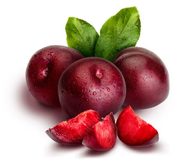 Appetizing and healthy red plums, whole and cut into segments with an aspect of illustration. Includes leaves of the plum tree. Isolated on white background.