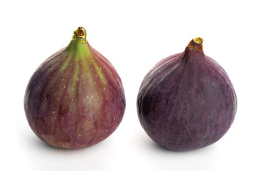 two fruits of figs on a white background