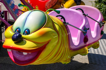 Carousel in the form of an caterpillar in an amusement park.
