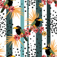 Tropical seamless pattern with colorful toucans and flowers.Summer vector graphic background.Textile texture