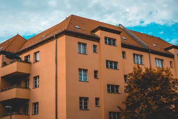 Fototapeta na wymiar orange facaded gdr building in the heart of east berlin