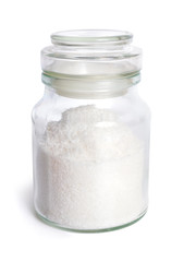Jar with grated coconut isolated on white background
