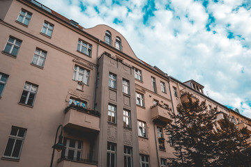Fototapeta na wymiar grey colored building with dramatic sky