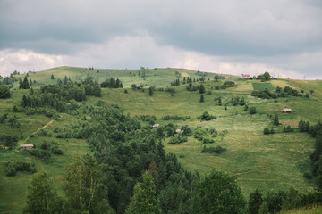 Fototapeta na wymiar cloudy summer landscape of Carpathian mountains, meadows and sky. Ukraine