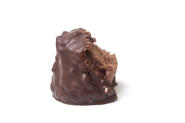 closeup of broken milk chocolate in shaped rock on white background