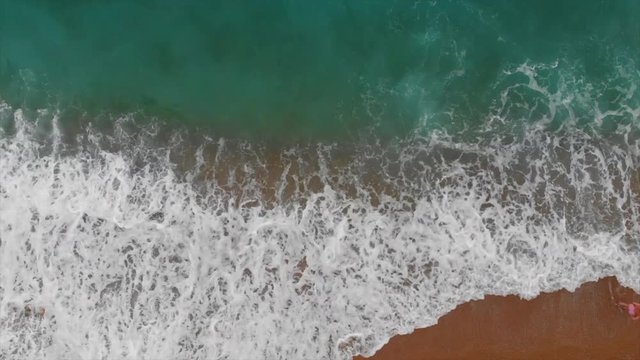 Rise and flight over the waves of azure turquoise sea. Spain, Valencian Country,  Province of Alicante,  Costa Blanca,  Benitachell, Cala del Moraig, Summer 2018