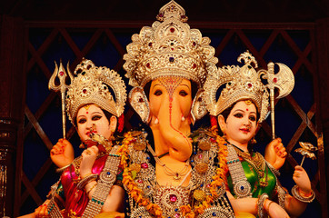 Lord Ganesha with Rddhi and Siddhi, Nagnathpar Sarvajanik Ganapati Mandal Trust, Pune, Maharashtra, India