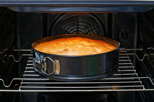 Homemade pie with apples is cooked in the oven