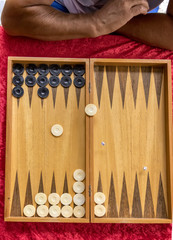 a man thinks of a move on a board game