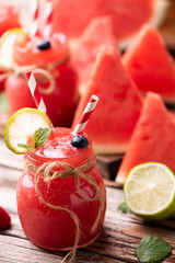 Water melon smothie on wooden table