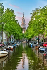 Tuinposter Beautiful Groenburgwal canal in Amsterdam with the Soutern church (Zuiderkerk) at sunset in summer © dennisvdwater