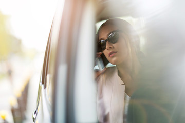 Young woman sitting in a car 
