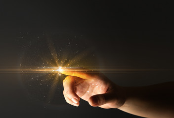 Female finger touching a beam of light