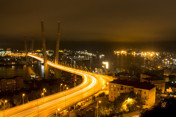 Fototapeta na wymiar Night bridge over the bay