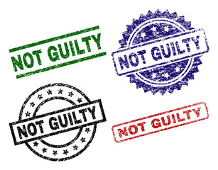 NOT GUILTY seal prints with damaged surface. Black, green,red,blue vector rubber prints of NOT GUILTY text with corroded texture. Rubber seals with round, rectangle, medallion shapes.