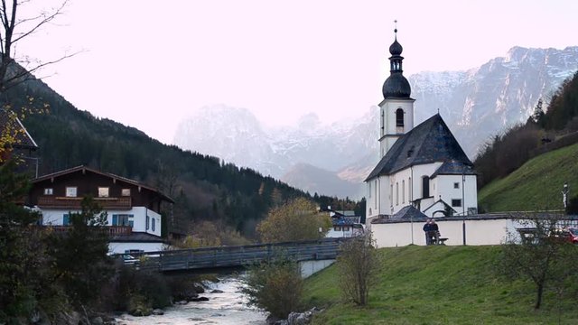 Autumn view of St. Sebastian parish church against Reiter Alpe, Bavaria, Germany