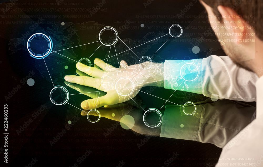 Poster Male hands touching interactive table with colorful world map on it 