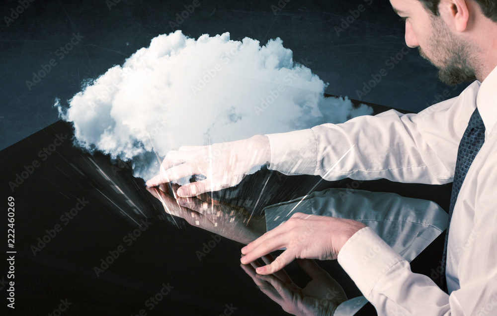 Poster male hands touching interactive table with a white cloud on it