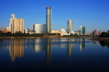 Fototapeta na wymiar Buildings of Yekaterinburg on the river bank