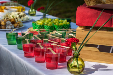Fruits and red / green gel on the table