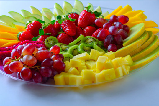 Fruit Platter With Fresh Grapes, Apple, Pineapple, Kiwi, Mango, Red Ripe Strawberry And Pitaya. Colorful Fruit Tray Best Health Good Food For Party And Holidays Table.