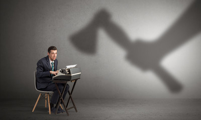 Shadow threatening hard worker man who is afraid

