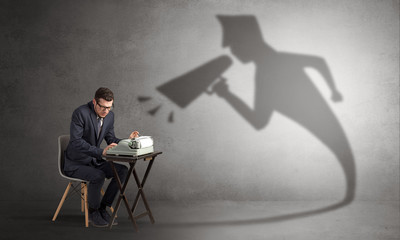Hard working businessman shadow yelling to himself concept
