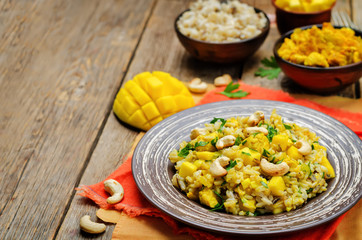 Curry chicken rice with mango and parsley