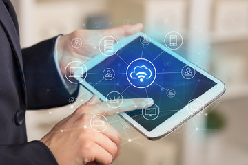 Business woman using tablet with network security and online storage system concept
