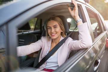 Young woman sitting in a car 
