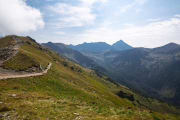 Obraz premium Tatra National Park, Poland. Pamoramic view of mountains landscape. Zakopane, Park Narodowy Wysokie Tatry. High Tatras. Świnicka (Svinica) Przełęcz (Swinica Pass) i Kasprowy Wierch (Kasper Peak).