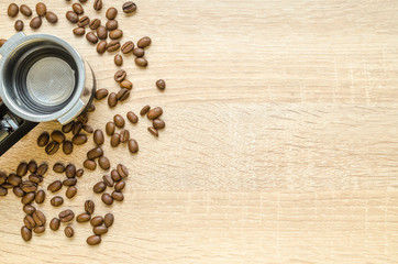 Coffee beans with cup on wooden table