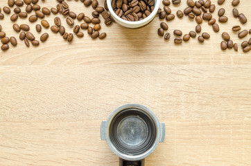 Coffee beans with cup on wooden table