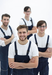 Fototapeta premium The team of responsible movers and their smiling leader