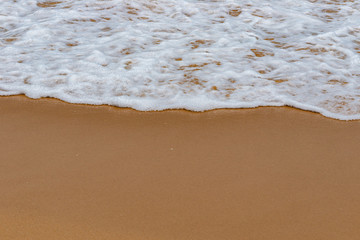 soft wave on a sandy beach