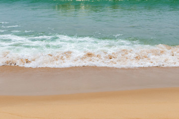 soft wave of an ocean on a sandy beach