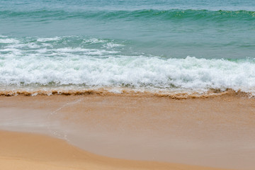 soft wave of an ocean on a sandy beach