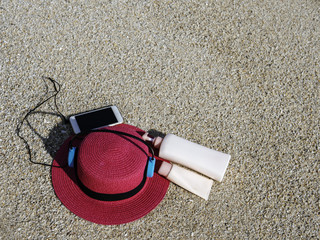Sunscreen, hat On the beach in summer.
