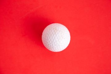 golf ball on red background