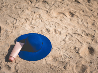 Sunscreen, hat On the beach in summer.