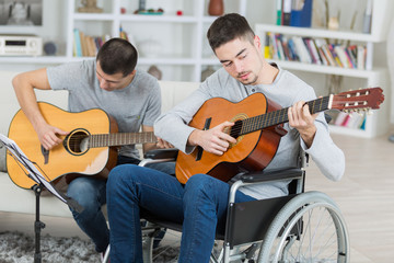 handicapped guitarist and friend
