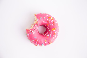 pink donut on white background - obrazy, fototapety, plakaty