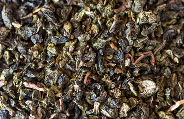 Leaves of green tea - food background. Macro with shallow depth of field.