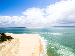 Fototapeta na wymiar cap ferret bunker france dune de pilar arcachon surfers clean beach vertical view drone