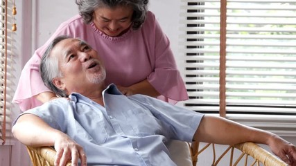 Senior man was massaged by senior woman at home. People with relaxation, lifestyle, healthcare concept. 4k resolution. - Powered by Adobe