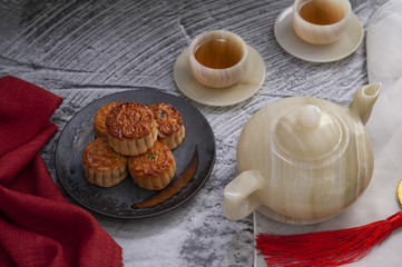 Obraz na płótnie Canvas Festival mooncake with tea for the Chinese