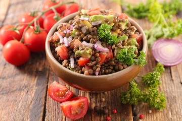 bowl of lentils with tomato and onion