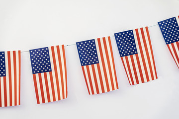 Garland of american flags of rectangular shape on light background, banner design. Fest, city street holiday, celebration concept